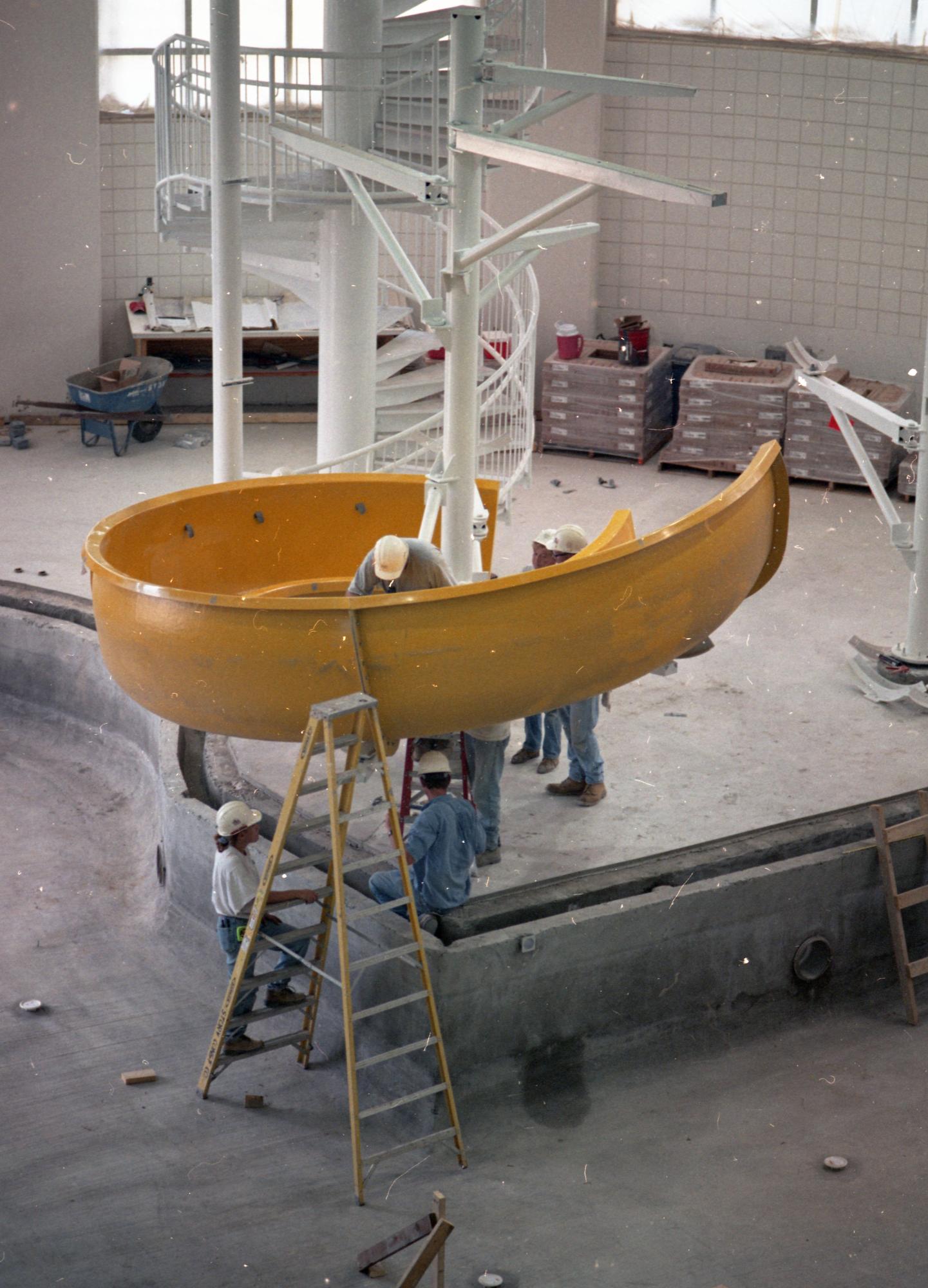 Workers assembling the WRC leisure pool slide