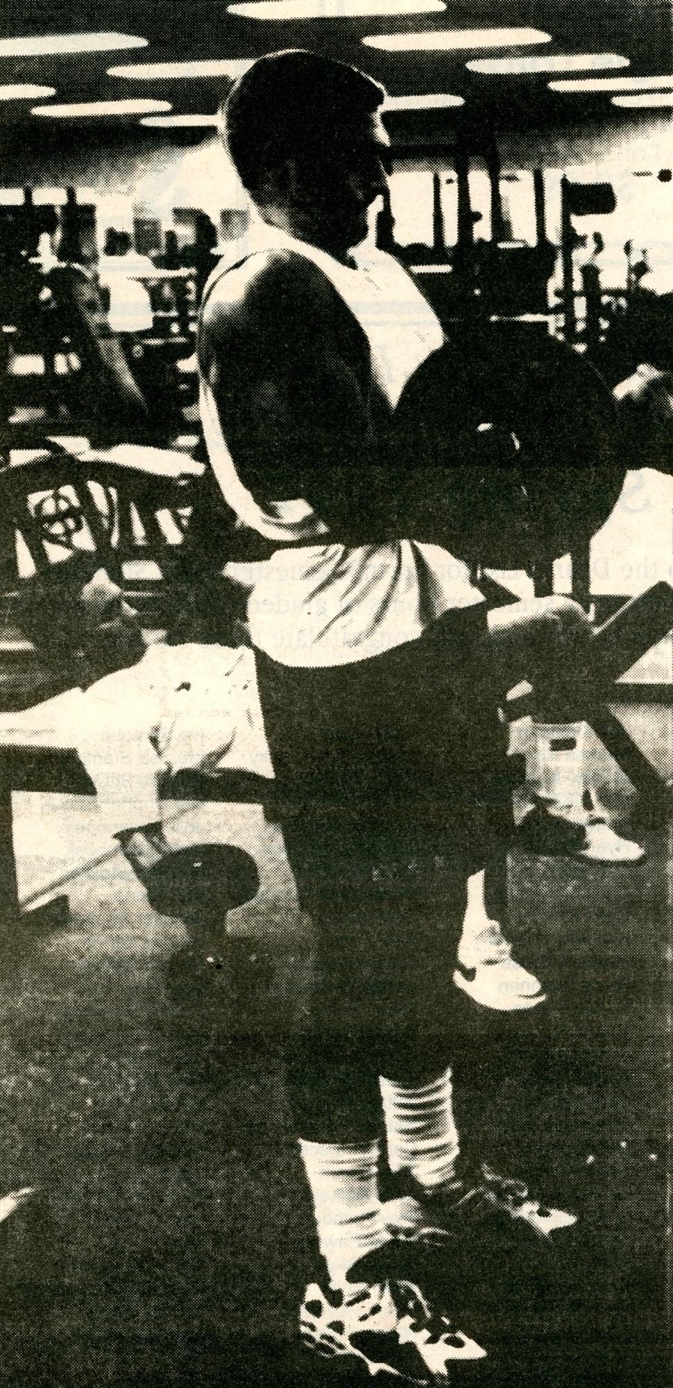 Student lifting weights in the WRC weight room