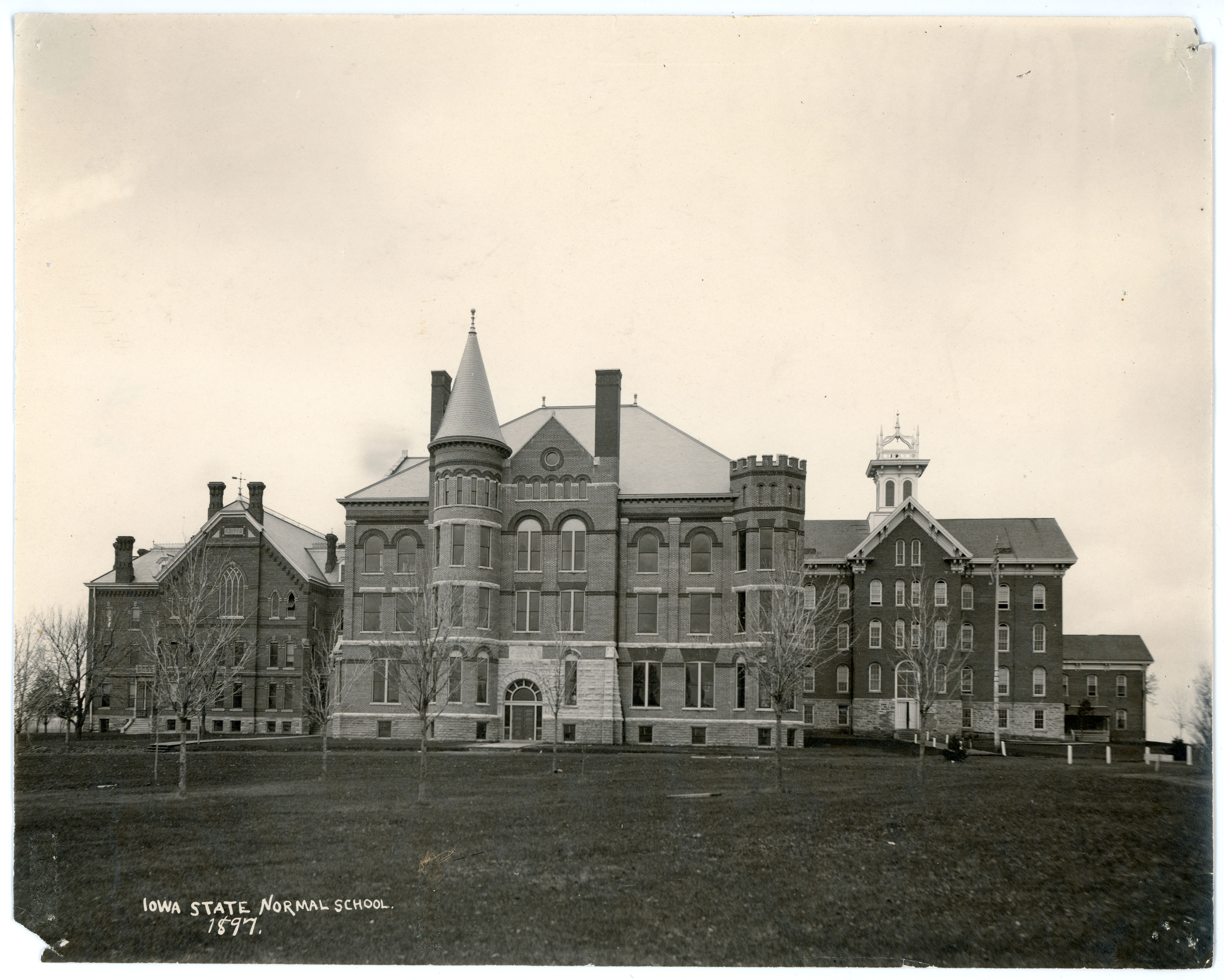 Three main campus buildings with the caption Iowa State Normal School 1897
