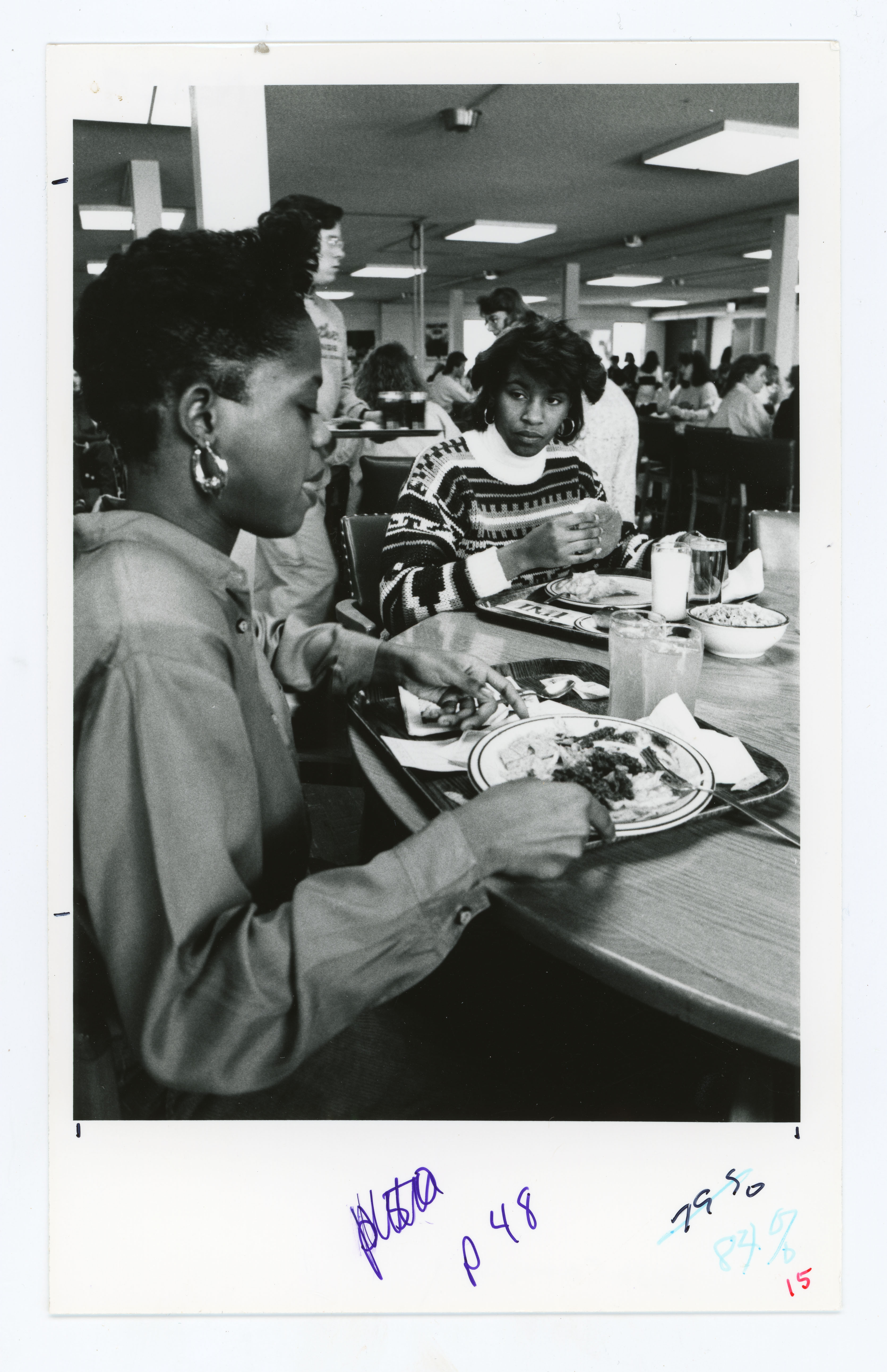 People eating at tables in dining center