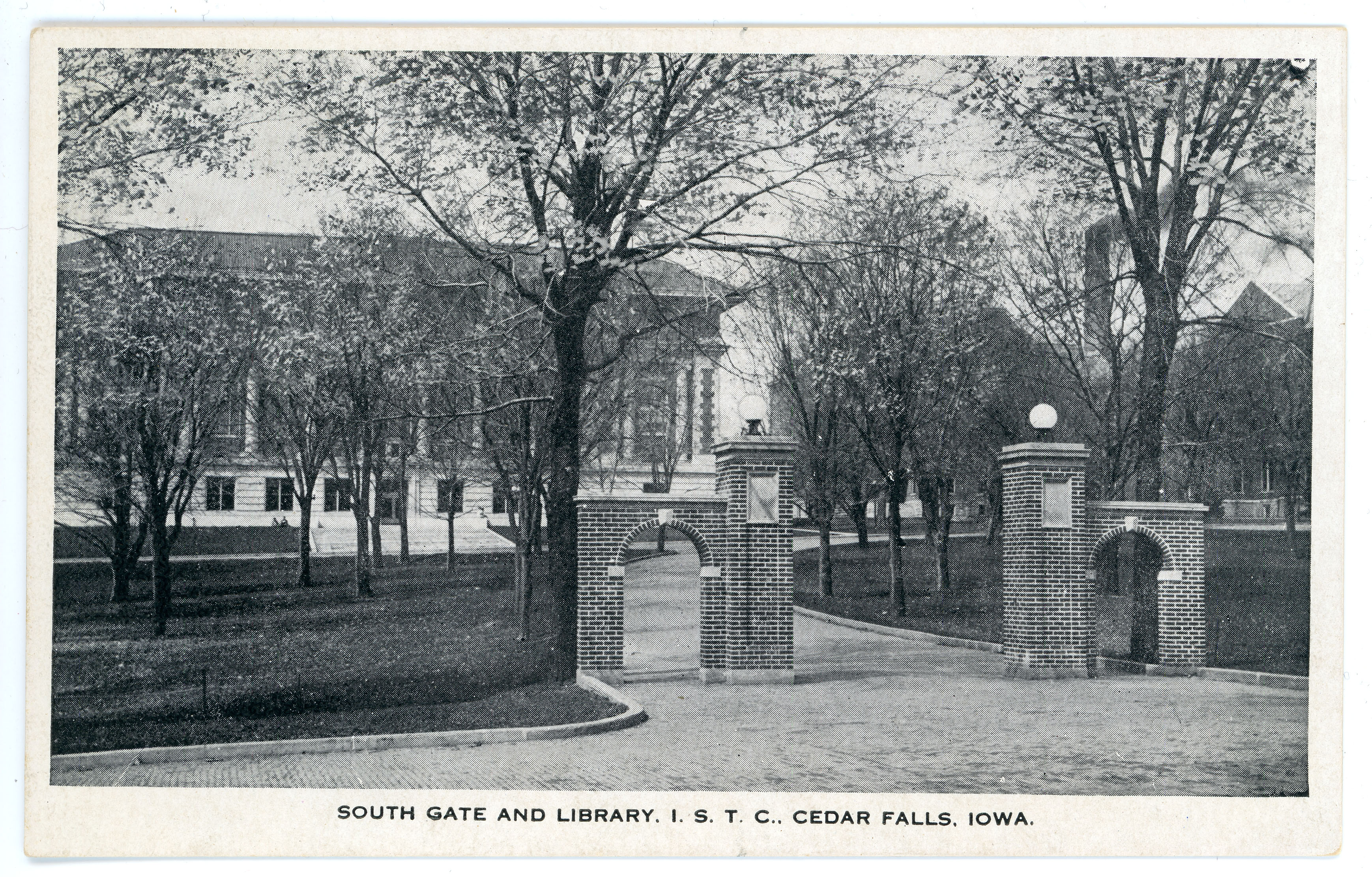 Two brick arches on either side of a path, text on postcard reads South Gate and Library ISTC Cedar Falls, Iowa