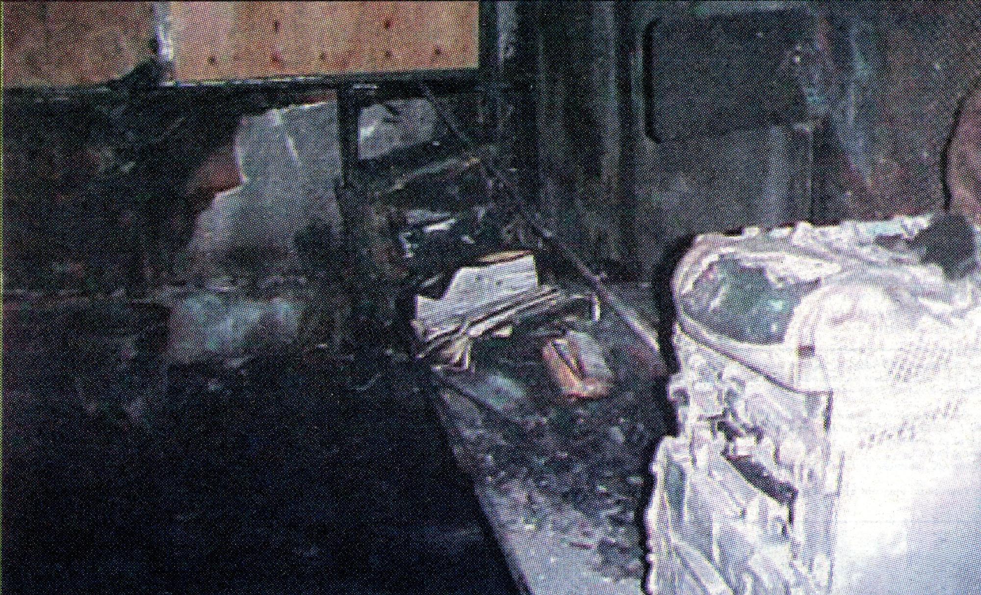 Printed in newspaper, room with ashes and charred paper and equipment