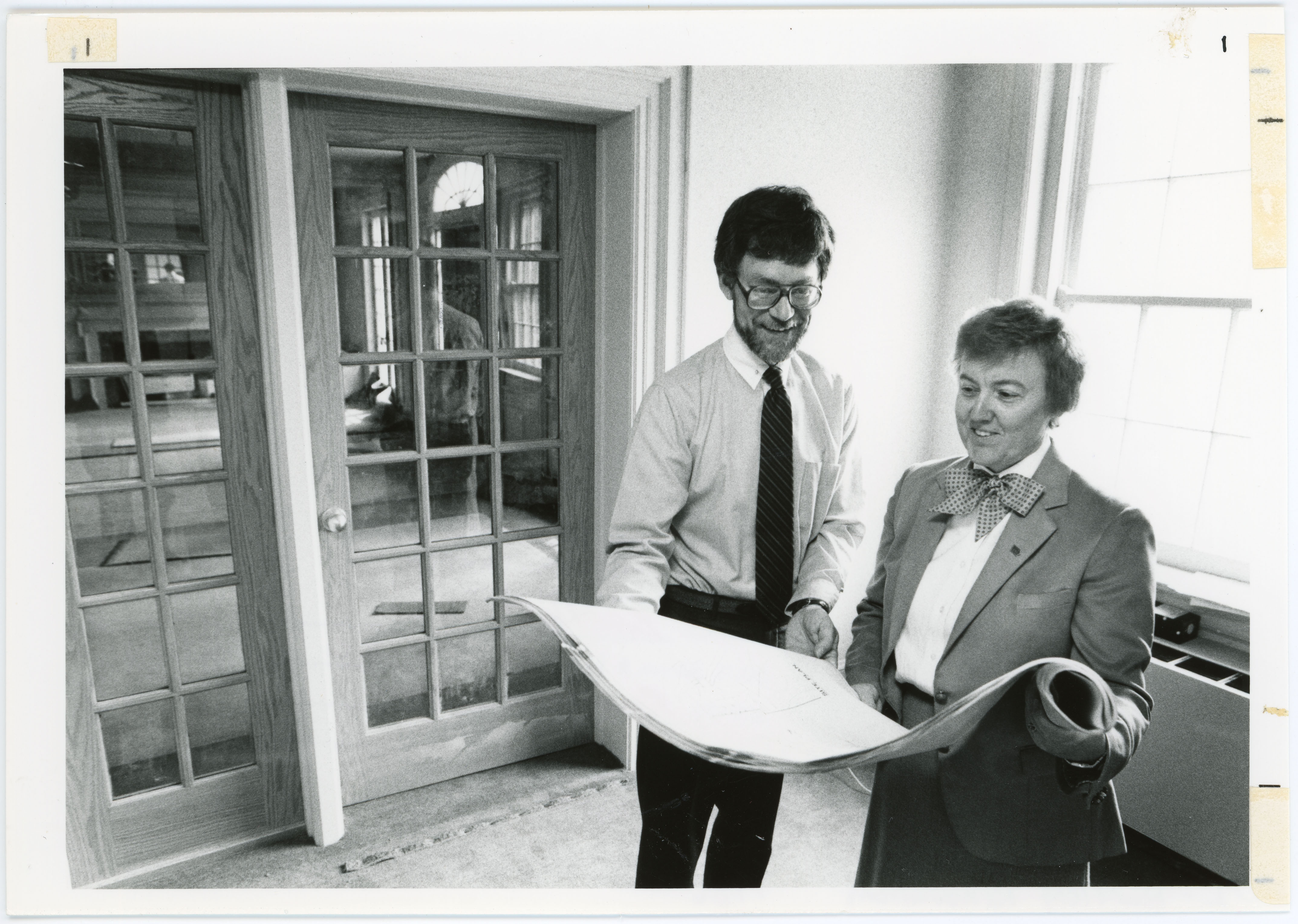 Morris Mikkelsen of the Campus Planning Staff and Vice President of Student Services Sue Follon look at renovation plans