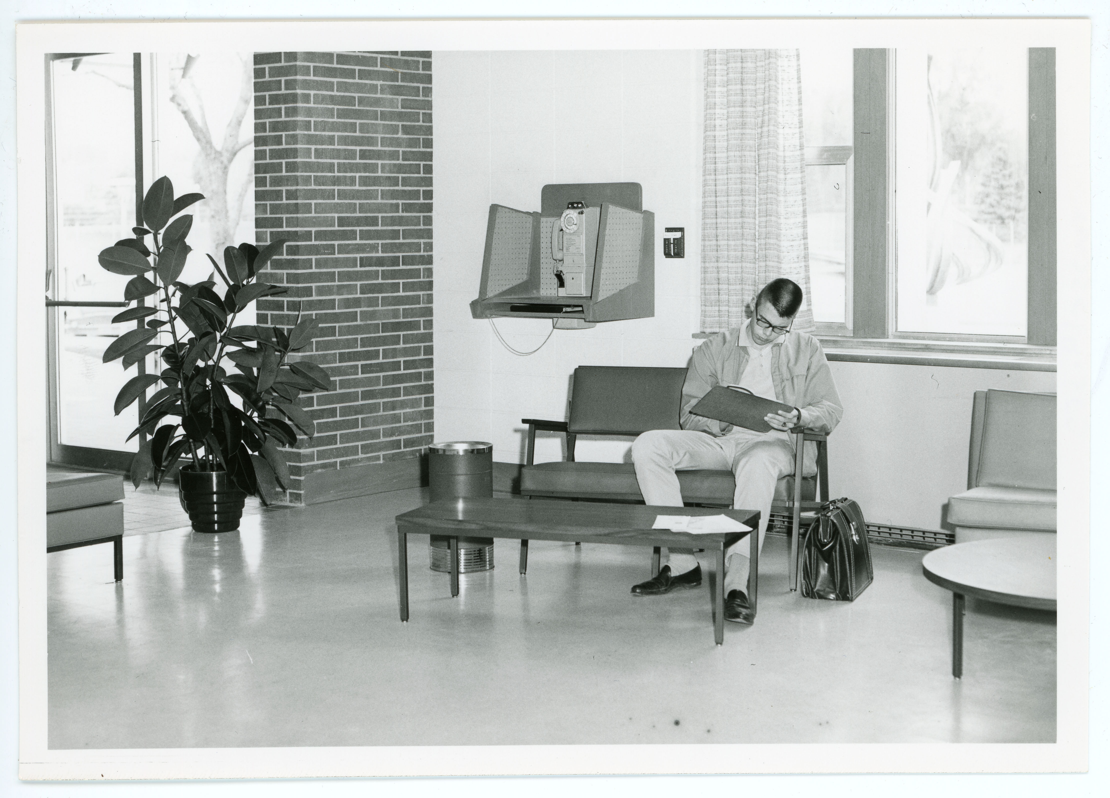 Student sitting in the Russell Hall lounge, circa 1960s