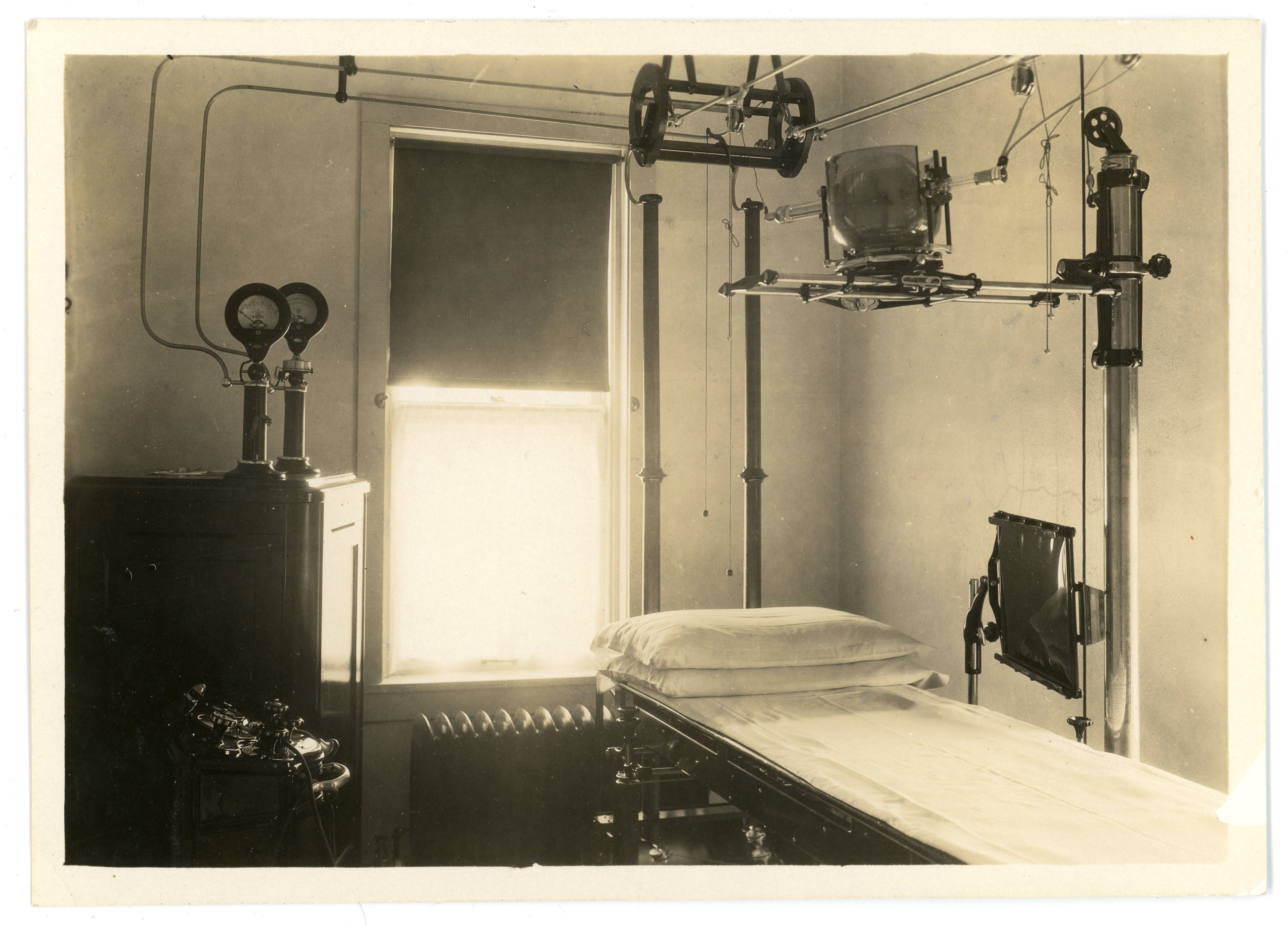 An exam room and x-ray machine in the Student Health Center hospital