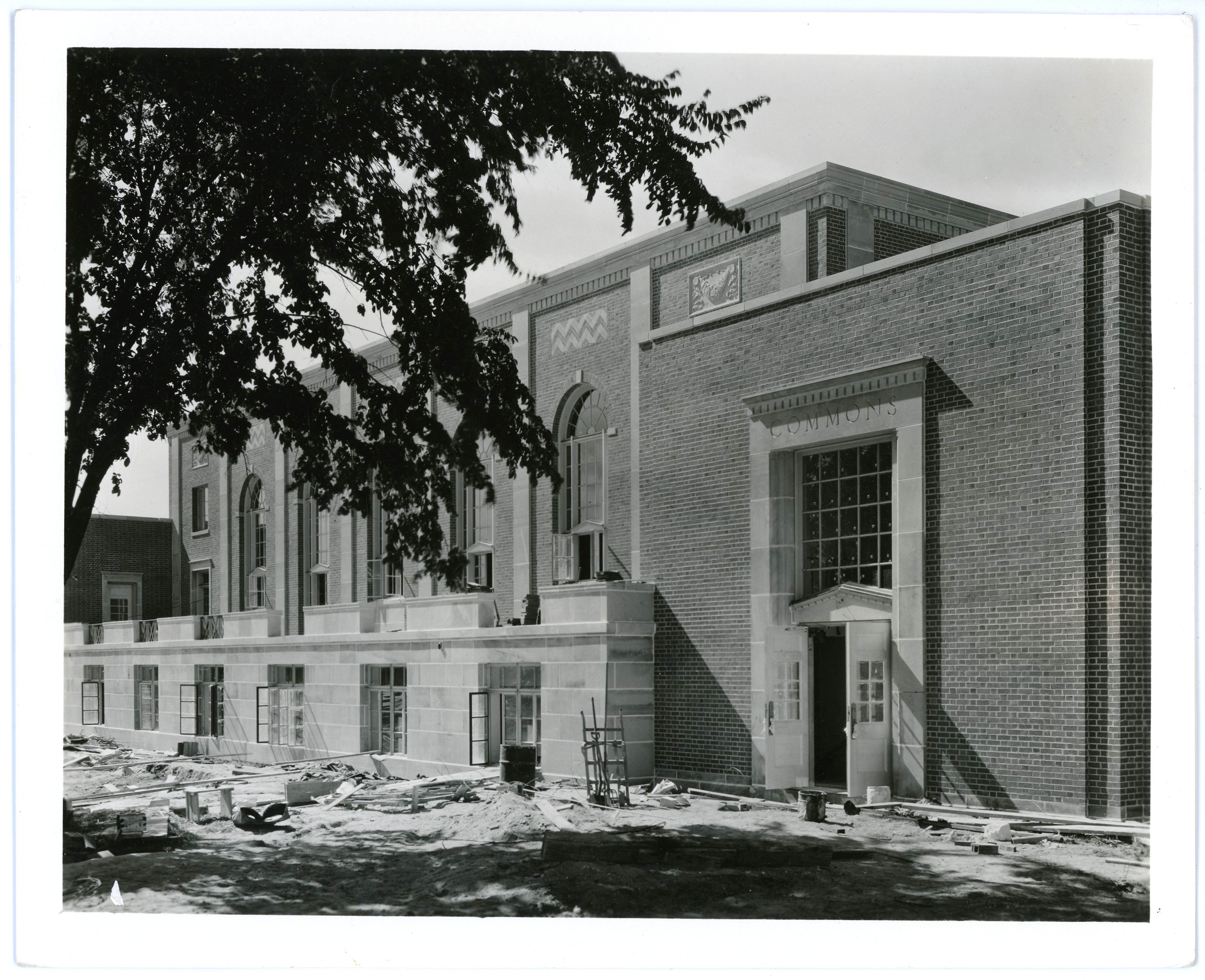 Construction on side of mostly-built brick building