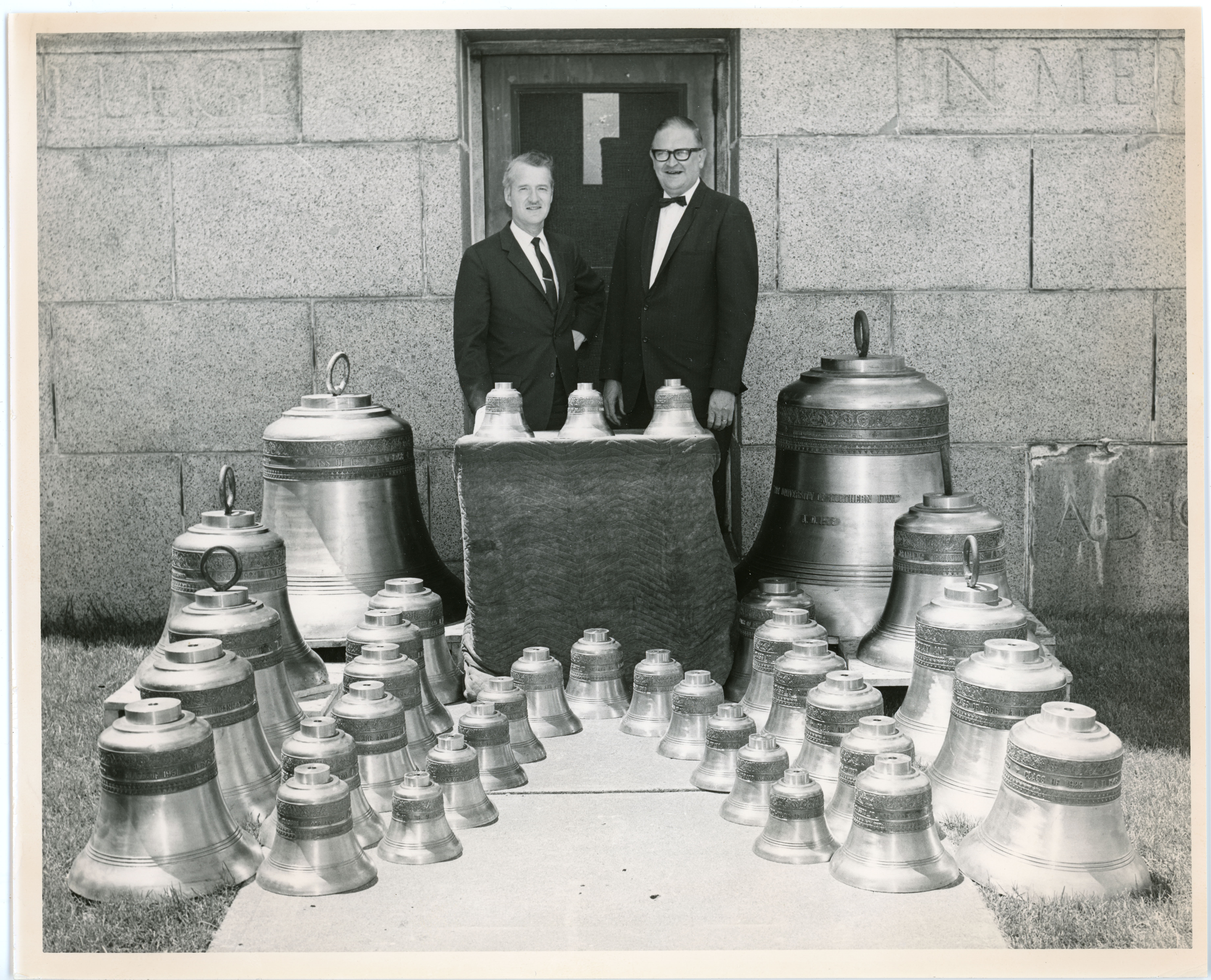 Two men with 36 bells of various sizes
