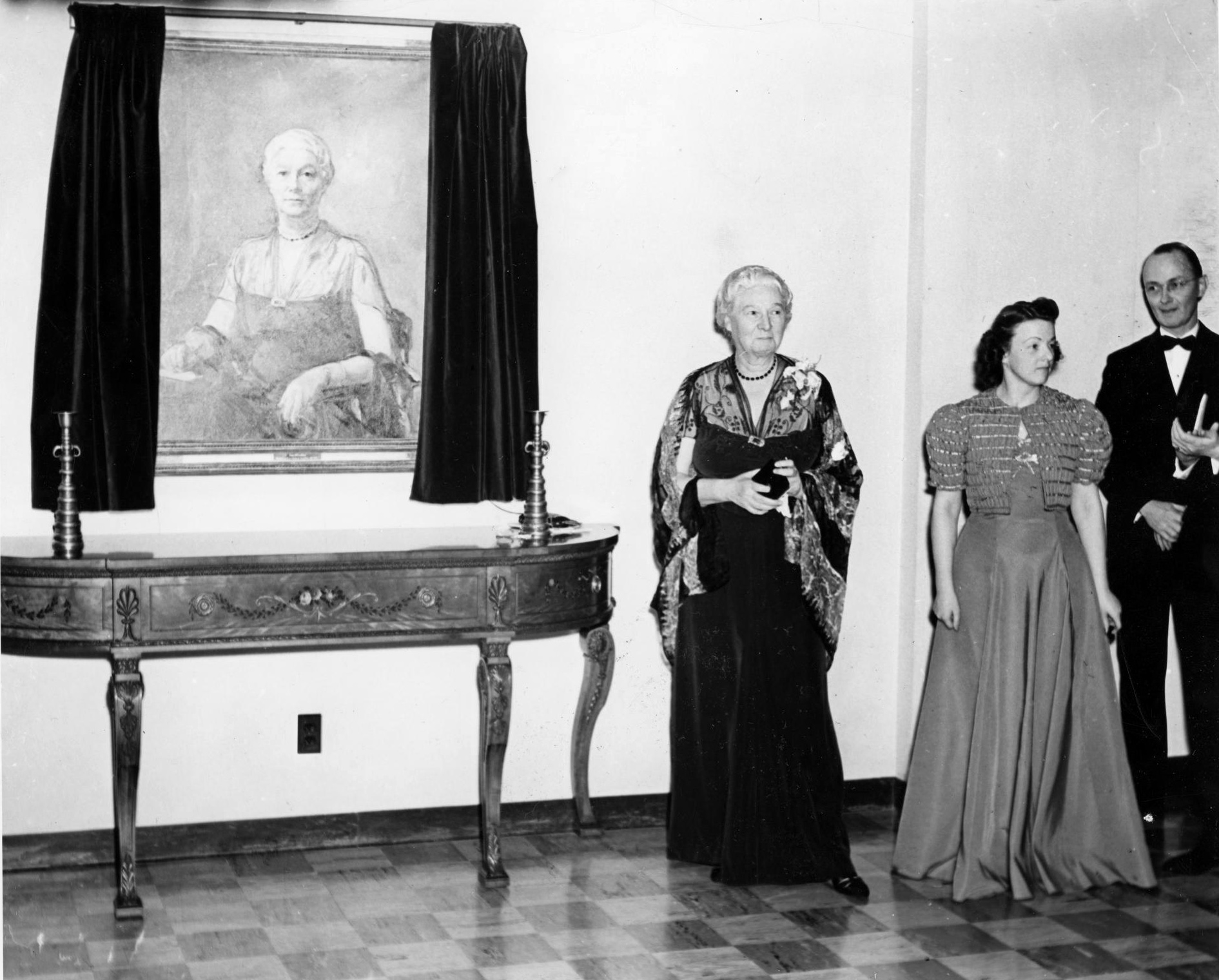 Anna B. Lawther standing next to her portrait at Lawther Hall dedication ceremony