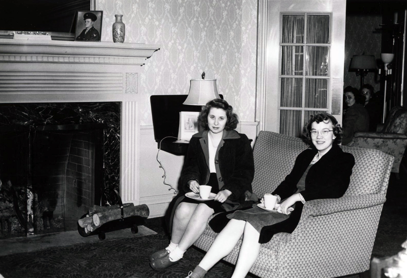 Two students sit in Lawther Hall lounge