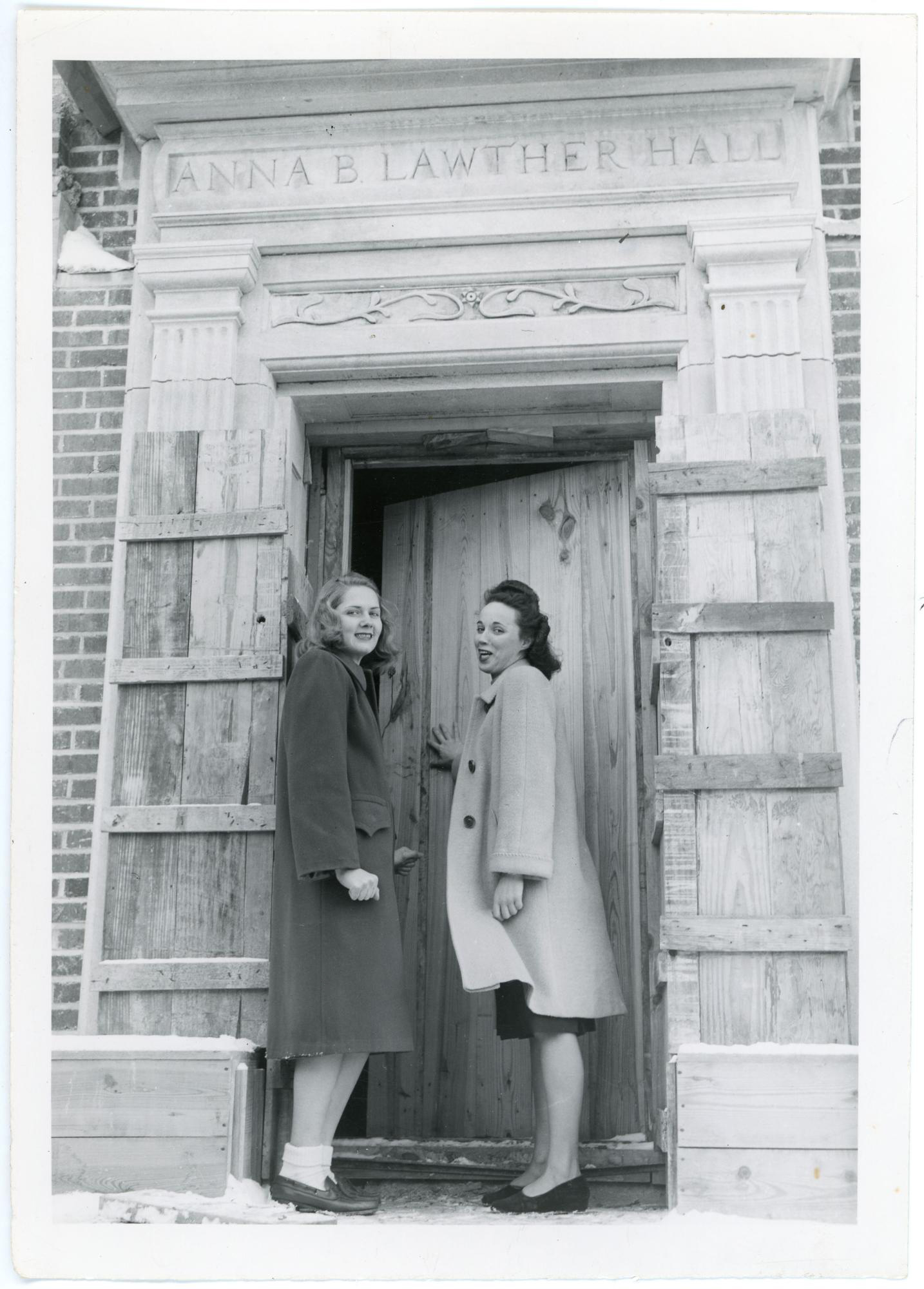 Two students checking in on a nearly completed Lawther Hall