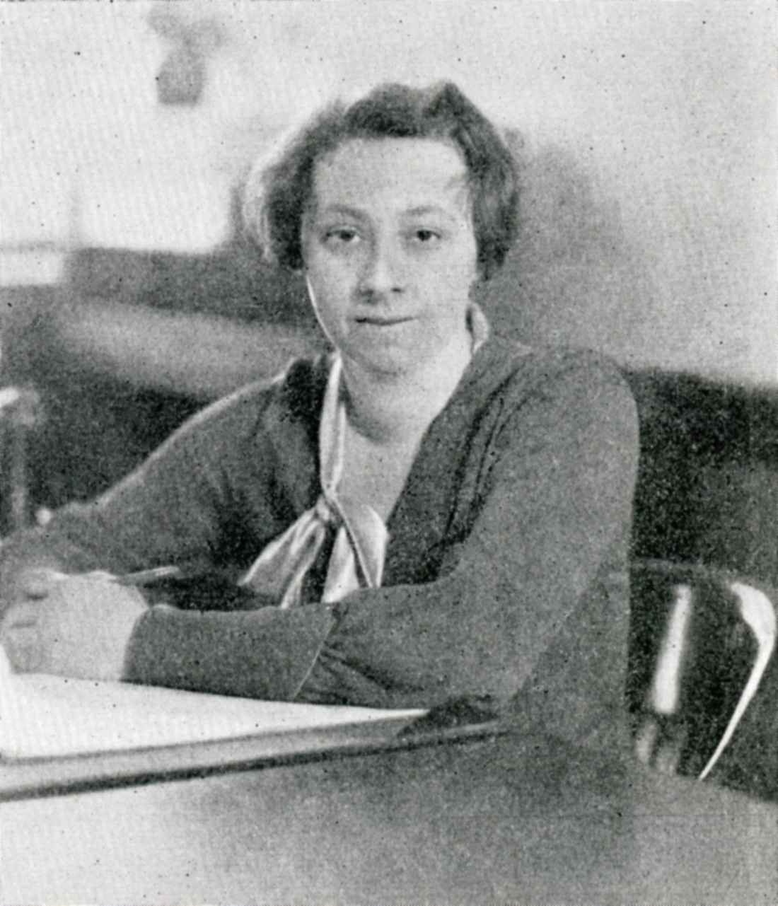 Photo of Monica R. Wild sitting at a desk