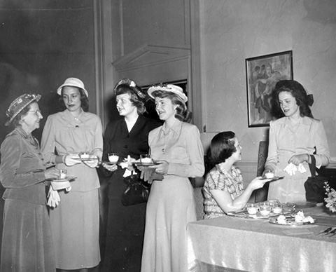 Associated Women Students' Women's Day Tea; Dean of Women Sadie B. Campbell on the far left. Citation: “AWS Women’s Day,” undated, in the University of Northern Iowa Photograph Collections, ORG 2- Government, A.W.S. (Associated Women Students) Box 5 Folder 5, ORG.02_00017, University Archives, Rod Library, University of Northern Iowa