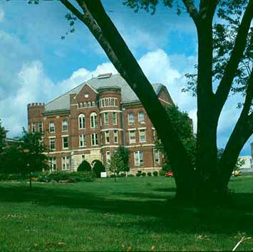 Exterior photo of Old Administration building with tree in foreground