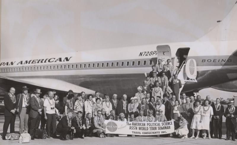 Members of the American Political Science Association World Tour Seminar standing in front of their plane.