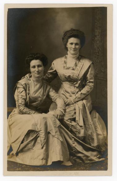 Two woman sitting for a photo