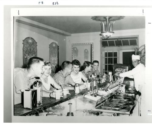 Photograph of students sitting at the Fountain Room counter