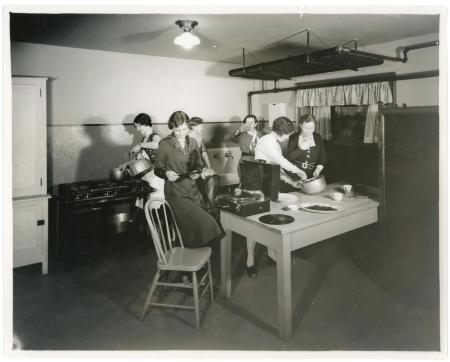 Photograph of women in Bartlett Hall student kitchen, 1932.