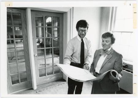 Morris Mikkelson of the Campus Planning staff and Vice President of Student Services Sue Follon look at Bartlett Hall renovation plans, 1986.