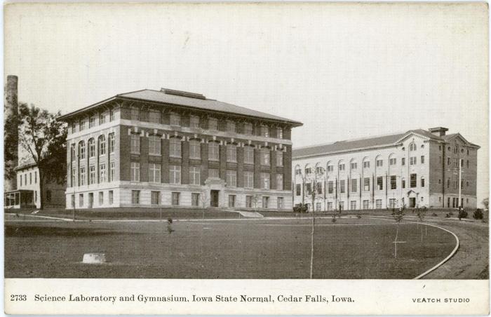 Postcard depicting an exterior photograph of Begeman Hall and the Gymnasium