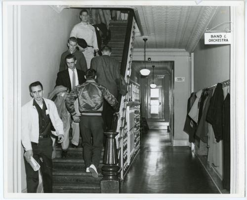 Photograph of several students on the narrow Central Hall staircase