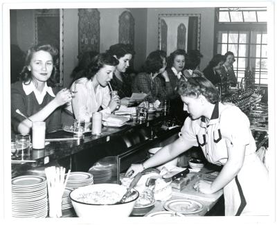 Photograph of several women sitting at the counter in the Commons Fountain Room