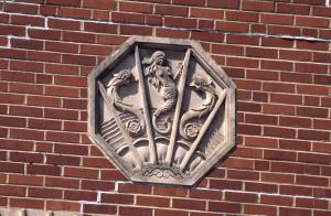 Photo of a decorative motif depicting a mermaid on the south side of the swimming pool building