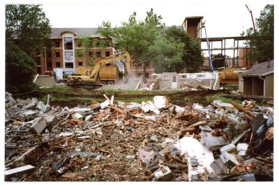 College Courts units being demolished with Panther Village under construction in the background
