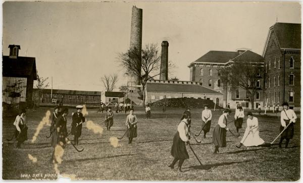 Women playing field hockey, 1892