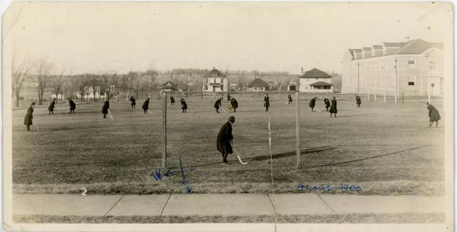 Women playing field hockey, about 1918.