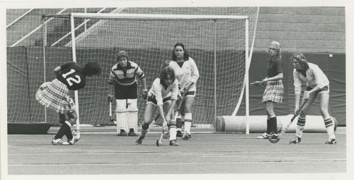 Women playing field hockey, 1979