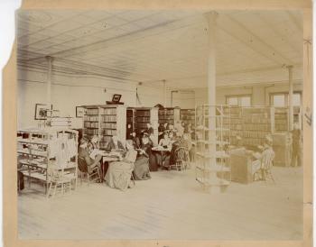 Several students in the library in the Old Administration Building