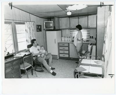 A family in a South Courts unit's kitchen