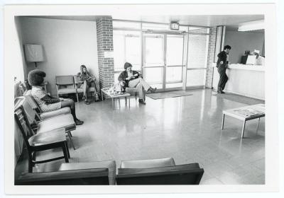 Students sitting in Student Health Center lobby