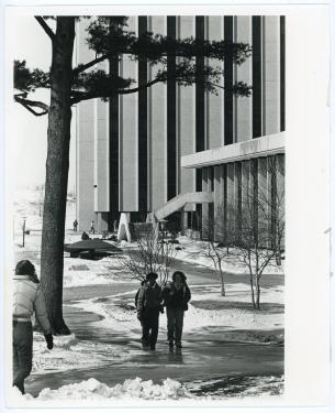 Students walking near the Towers during the winter