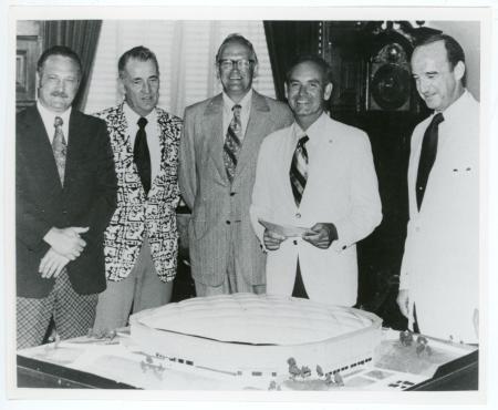 Left to right: Stan Sheriff, Robert Lounsberry, T. Wayne Davis, Robert Ray, and John Kamerick stand behind an architectural model of the UNI-Dome
