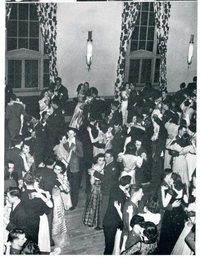 Several students dancing in the Commons recreation room