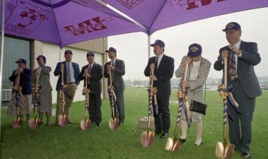 8 individuals standing in a line and holding golden shovels during the Wellness and Recreation Center Groundbreaking ceremony. 
