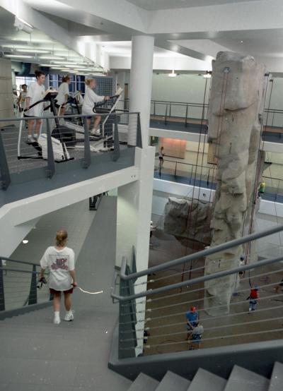 Photo of WRC stairway, several individuals can be seen using a variety of WRC facilities, including the rock climbing wall