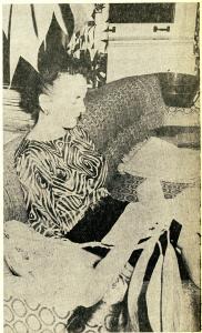 Helga Peterson Maucker sitting on a couch in the President's House