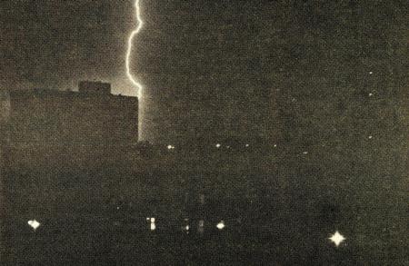 Photo of lightning striking Bender Hall during a storm
