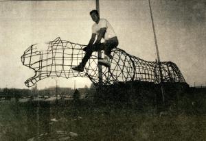 Sculptor Rob Laurence sitting on the wire panther sculpture he created to go in front of the UNI-Dome