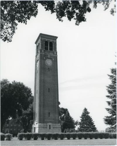 Exterior photo of the Campanile with line of bushes in the foreground