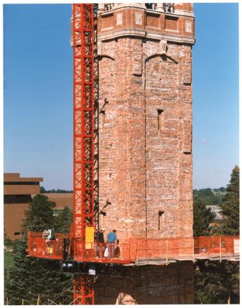 Workers replacing bricks during 1993-1995 Campanile renovation project