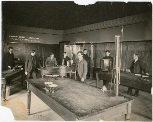 Photograph of 8 men in the Iowa State Normal School (UNI) Physical Science Laboratory