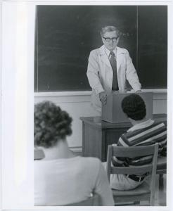 Photograph of professor Howard V. Jones leading a class