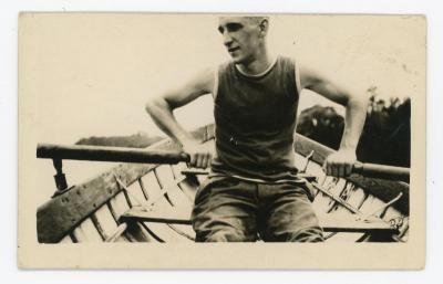 Eugene Francis Grossman photographed while rowing a rowboat. Eugene Francis Grossman photograph in the Eugene Francis Grossman Papers 1896-1965, #MsC-38, photographs of family and friends, box 1, University of Northern Iowa. 