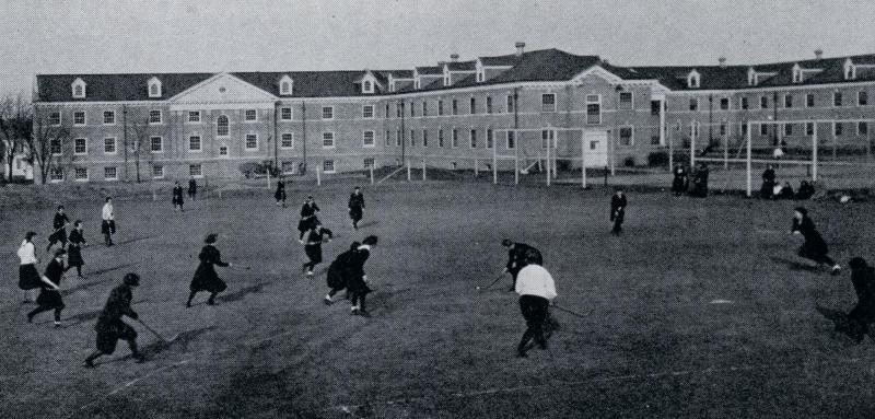 Women playing field hockey, 1924