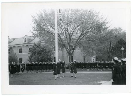 WAVES Color Guard raising the American flag, undated.
