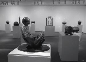 Photograph of several sculptures on white podium in the Kamerick Art Gallery