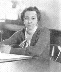 Photo of Monica R. Wild sitting at a desk